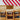 Three coffee AM bags with different blends on a red and white striped background