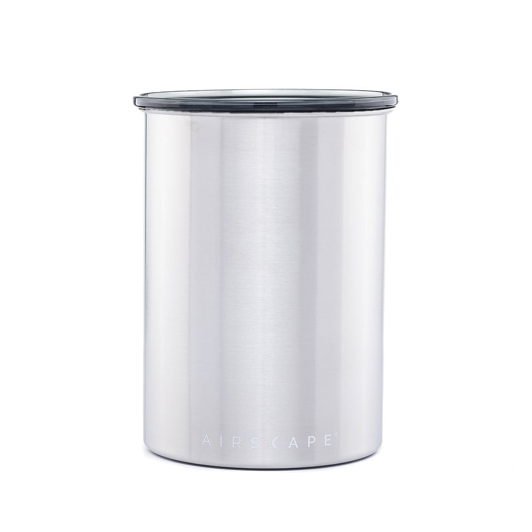Silver coffee canister with a black handle on a white background