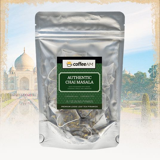Tea package labeled 'Authentic Chai Masala' with a blurred background of a famous monument.