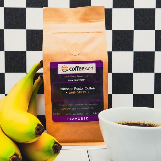 CoffeeAM bananas foster coffee package with a cup of coffee and bananas on a checkered background