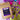 A brown kraft-paper coffee bag labeled "coffeeAM Birthday Cake Coffee, WHOLE BEAN, FLAVORED" lies on a backdrop of shiny purple tinsel, colorful pom-poms, and gold decorative lettering.