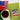 Green bag of Blue Eyes Tisane Tea with an American flag label, next to a cup of coffee and a poinsettia plant.
