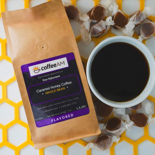 CoffeeAM Caramel Honey Coffee package with a cup of coffee and caramel candies on a yellow honeycomb background