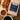 Caramel pecan coffee package with a cup of coffee and pecans on a wooden board