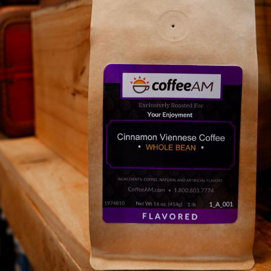 CoffeeAM Cinnamon Viennese Coffee package on a wooden surface