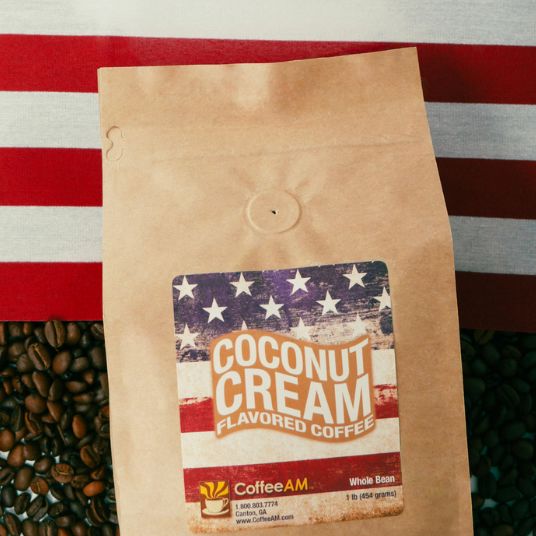 Kraft paper coffee bag with 'Coconut Cream Flavored Coffee' label on an American flag background