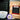 CoffeeAM Bali Blue Moon single serve coffee packaging with a cup of coffee and a coffee machine.