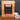 CoffeeAM Costa Rica Reserve single serve coffee package with coffee beans and a K-cup on a dark surface.