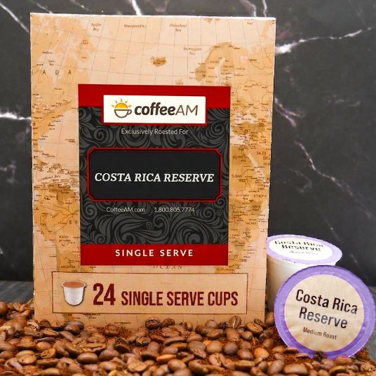 Box of Coffee AM Costa Rica Reserve single serve coffee cups with a parrot illustration on a map background.