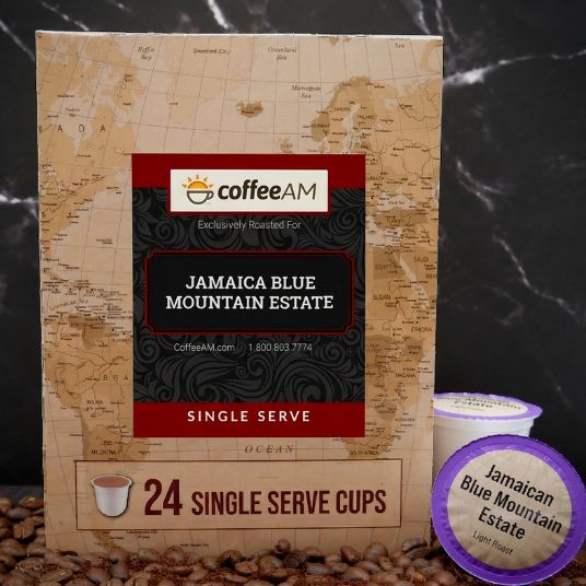 Box of Coffee AM Jamaica Blue Mountain Estate single serve coffee cups with a scenic background.