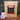 CoffeeAM Tanzania Peaberry single serve coffee package with coffee beans on a dark background
