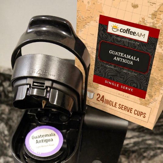 Box of Coffee AM Guatemalan Antigua single serve cups with a map background