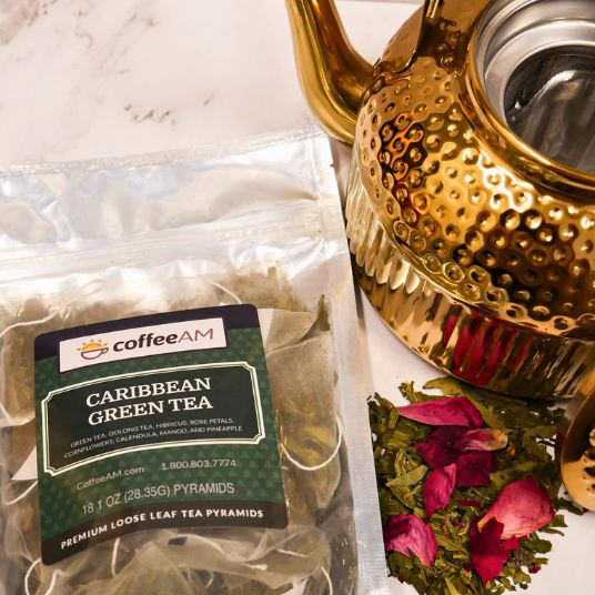 Tea package labeled 'Caribbean Green Tea' with a tropical background