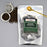 Tea packaging with loose tea and a tea strainer on a gray background