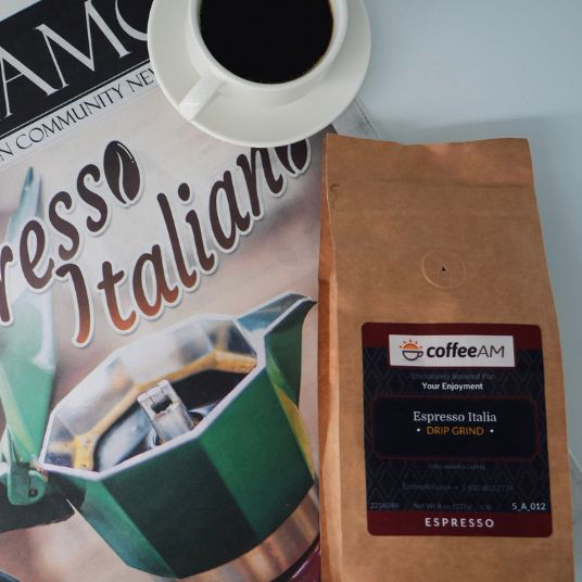 Coffee AM Espresso Italiana package with a cup of coffee and magazine on a white background