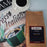 Coffee AM Espresso Italiana package with a cup of coffee and magazine on a white background