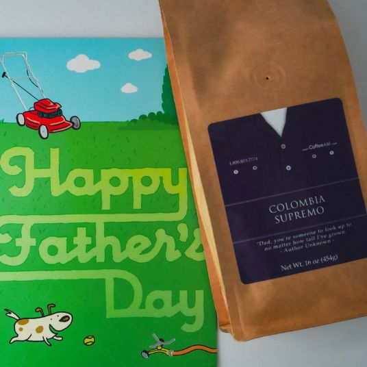 Coffee bag labeled 'Colombia Supremo' next to a 'Happy Father's Day' card with a lawn mower illustration.