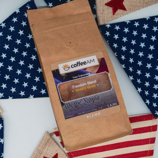 CoffeeAM Freedom Blend package on a flag background