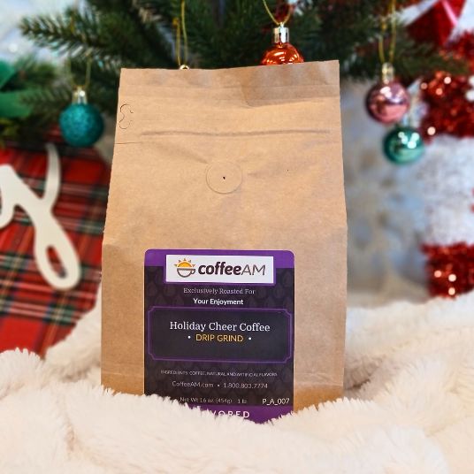Kraft paper coffee bag with a purple label featuring 'coffeeAM' brand on a festive background.