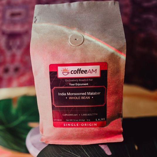 Coffee AM bag of India Monsooned Malabar whole bean coffee on a blurred background