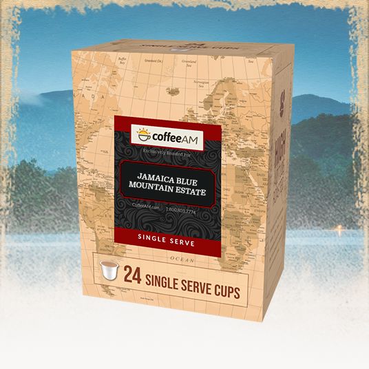 Box of Coffee AM Jamaica Blue Mountain Estate single serve coffee cups with a scenic background.