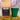 CoffeeAM King Cake Coffee package with a green cup and gold tinsel on a blurred background