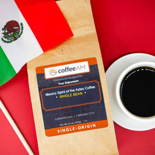 CoffeeAM Mexico Spirit of the Aztec coffee package with a cup of coffee on a red background