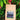 Kraft paper coffee bag with a label on a natural background of greenery and flowers