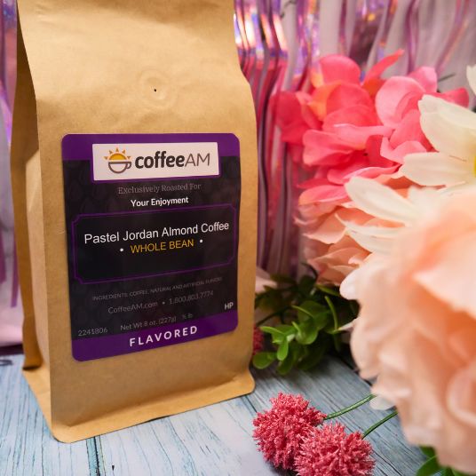 CoffeeAM pastel Jordan Almond coffee package with flowers on a wooden surface