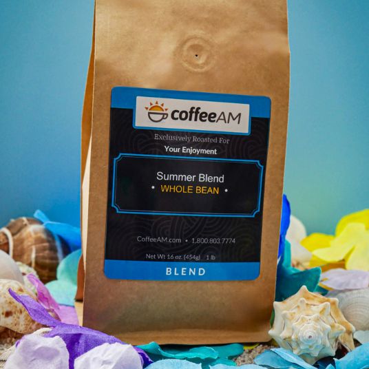CoffeeAM Summer Blend coffee package with a beach-themed background
